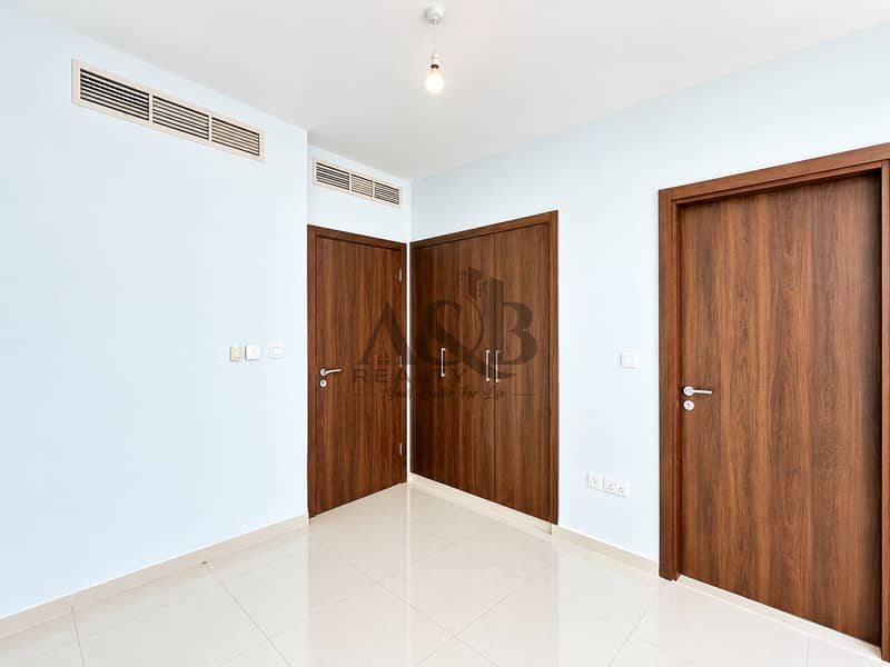 14 Bright Minimalist Room with Wooden Doors. png