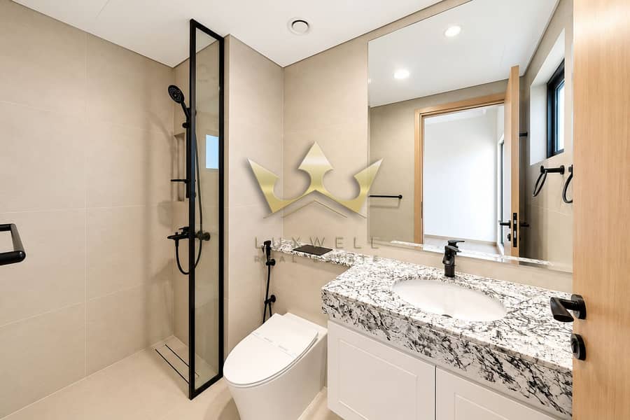 12 Modern Beige Bathroom with Black Fixtures. png
