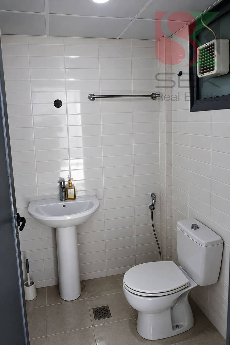 9 Clean, Tidy Compact Bathroom. png