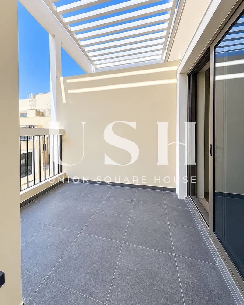 8 Sunlit Minimalist Balcony Under Pergola. png