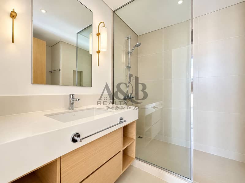 14 Bright Minimalist Bathroom with Warm Brass Accents. png