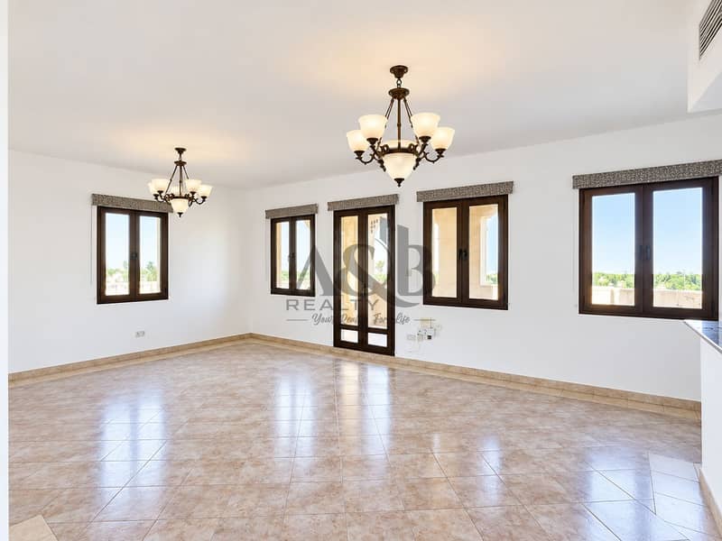 2 Bright Empty Living Room with Chandeliers. png