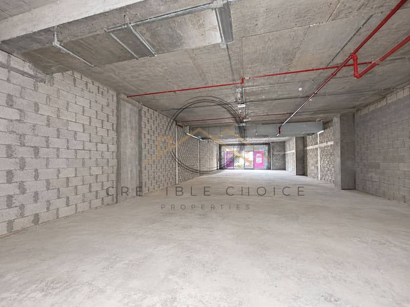 4 Unfinished Industrial Space with Red Piping. png