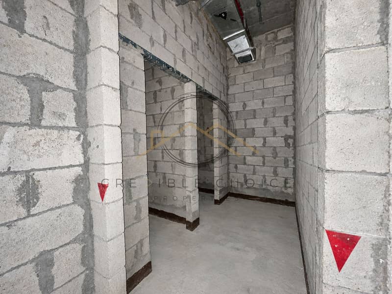 5 Unfinished Concrete Block Corridor. png