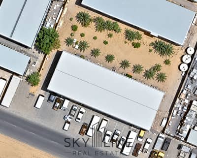 Industrial Land in vendita a Al Jurf, Ajman - Industrial Warehouse Yard Aerial View. png Industrial Land in vendita a Al Jurf, Ajman - Industrial Warehouse Yard Aerial View. png