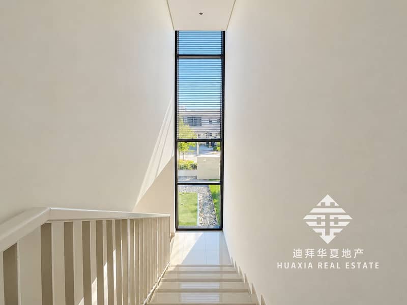12 Sunlit Minimalist Stairwell to Garden Views. png