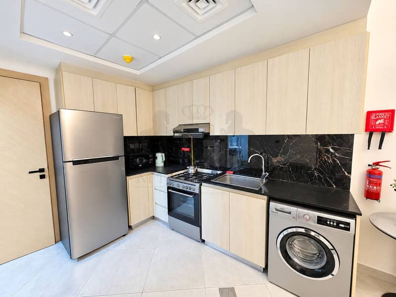 14 Modern Compact Kitchen with Laundry Zone. png