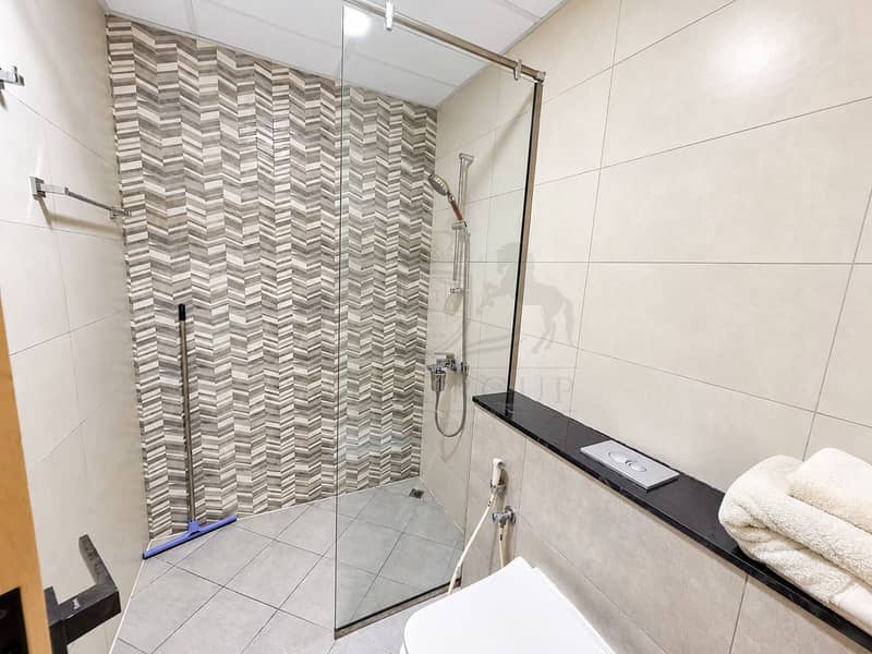 15 Modern Chevron-Tiled Bathroom. png