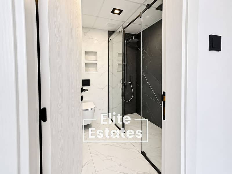 9 Modern Marble Bathroom with Glass Shower. png