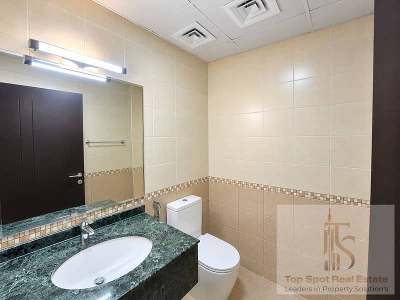 14 Clean Modern Beige-Tiled Bathroom. png