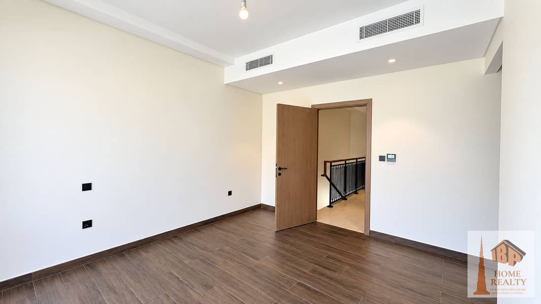 5 Bright Empty Bedroom With Dark Wood Floors. png