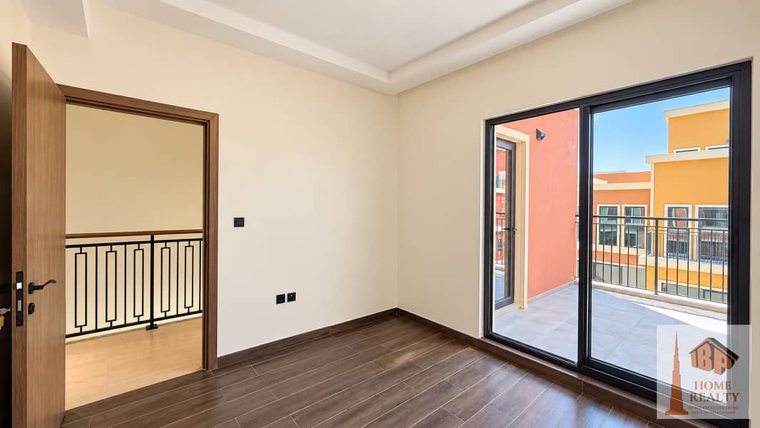 8 Sunlit Empty Bedroom with Balcony View (1). png