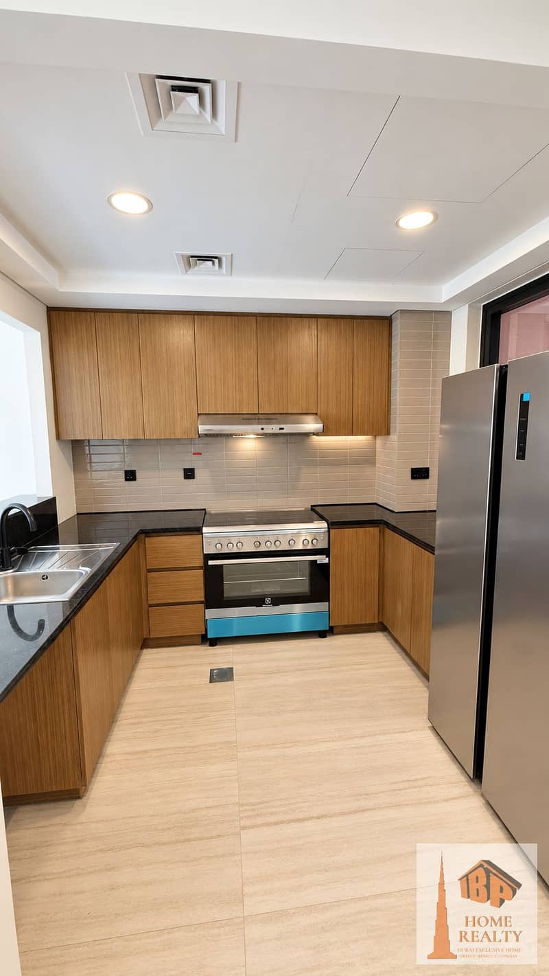 9 Bright U-Shaped Kitchen with Warm Wood Cabinetry. png
