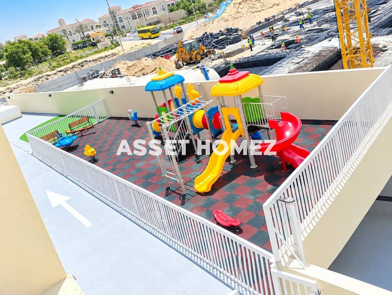 8 Colorful Rooftop Playground Overlooking Construction. png