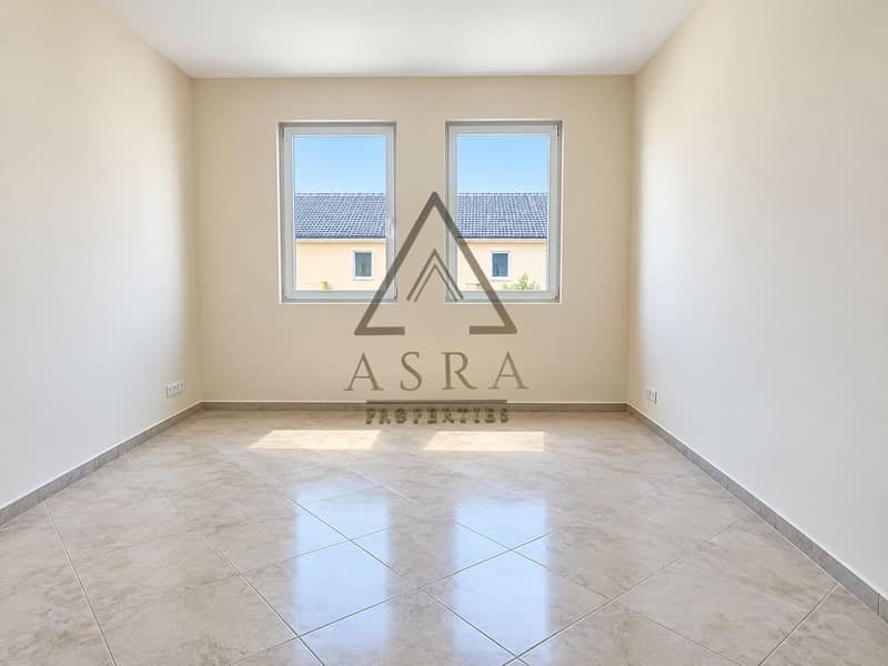 3 Sunlit Minimalist Room with Twin Windows. png