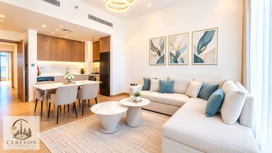 فلیٹ 1 غرفة نوم للبيع في مجان، دبي - Warm Modern Open-Plan Living Space. png