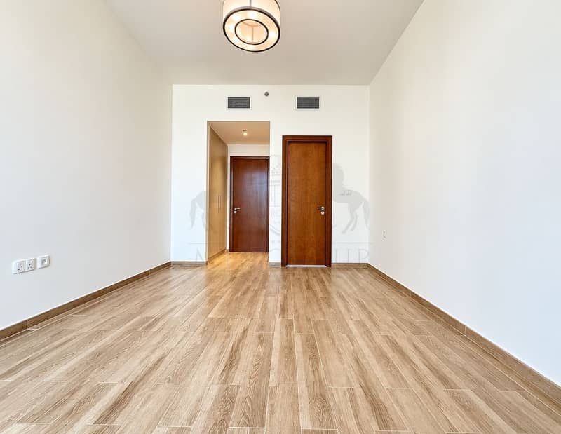 11 Minimalist Room with Recessed Wood Doors. png