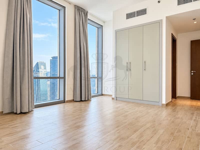 15 Sunlit Minimalist Bedroom with City Views. png