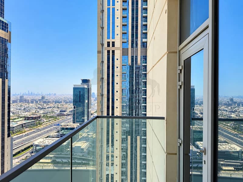 18 Dubai Skyline from a Glass Balcony. png