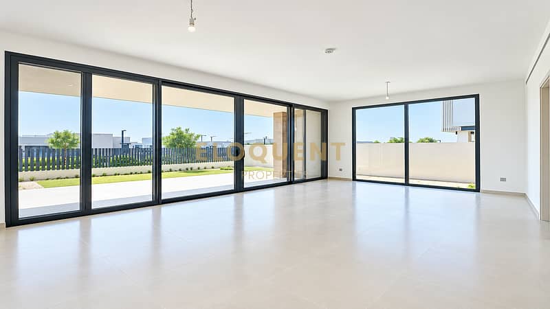 2 Bright Minimalist Room with Glass Doors. png