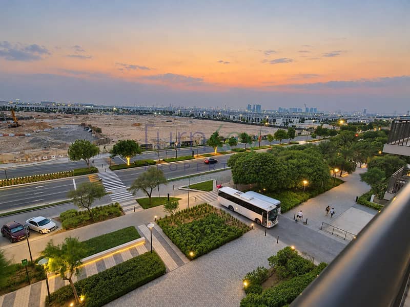 11 Sunset Cityscape with Bus and Plaza. png