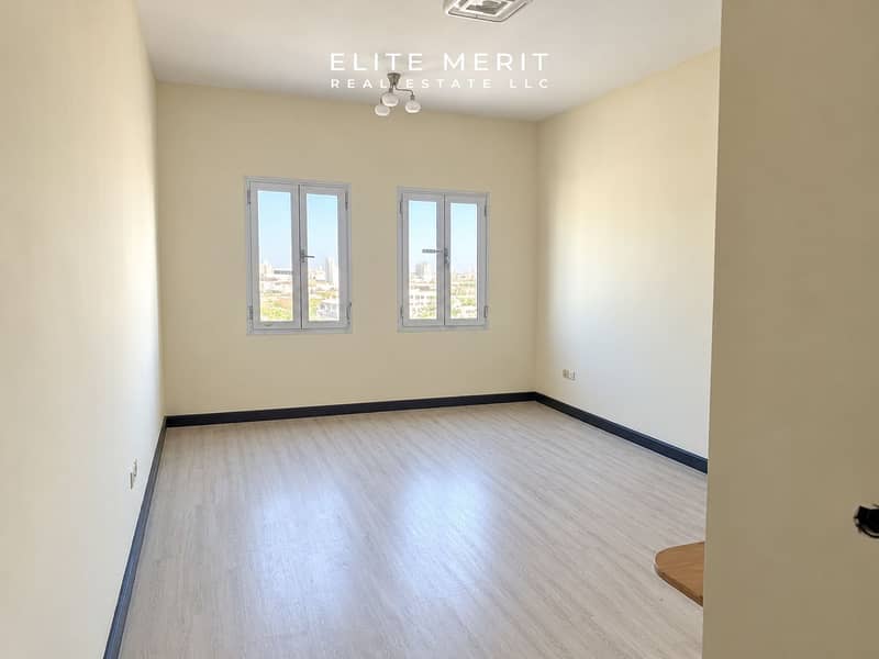 2 Bright Minimalist Room with City Windows. png