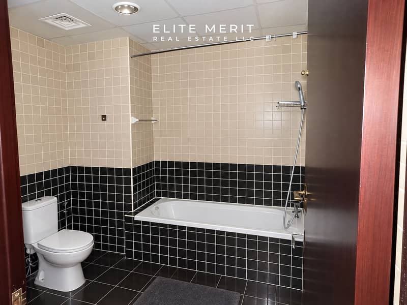 9 Modern Beige and Charcoal Tiled Bathroom. png
