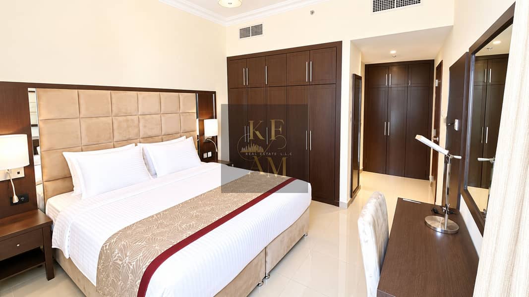 6 Modern Hotel Bedroom with Dark Wood Wardrobes. png