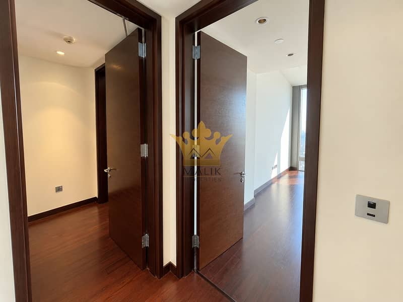 13 Modern Hallway with Open Wooden Doors. png