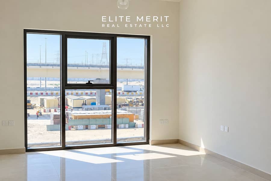 2 Sunlit Modern Room Overlooking Construction Site. png