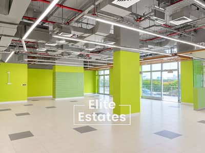 Shop zum Miete in Dubai Land Residence Complex (DLRC), Dubai - Bright Lime-Green Industrial Retail Interior. png Shop zum Miete in Dubai Land Residence Complex (DLRC), Dubai - Bright Lime-Green Industrial Retail Interior. png