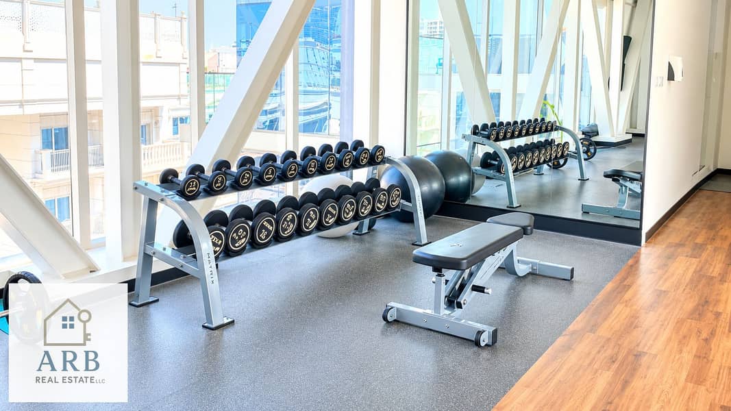10 Bright Modern Gym with Dumbbells and Bench. png