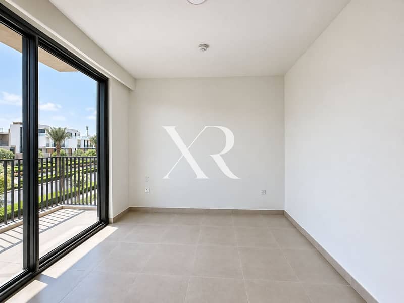 13 Sunlit empty bedroom with balcony. png