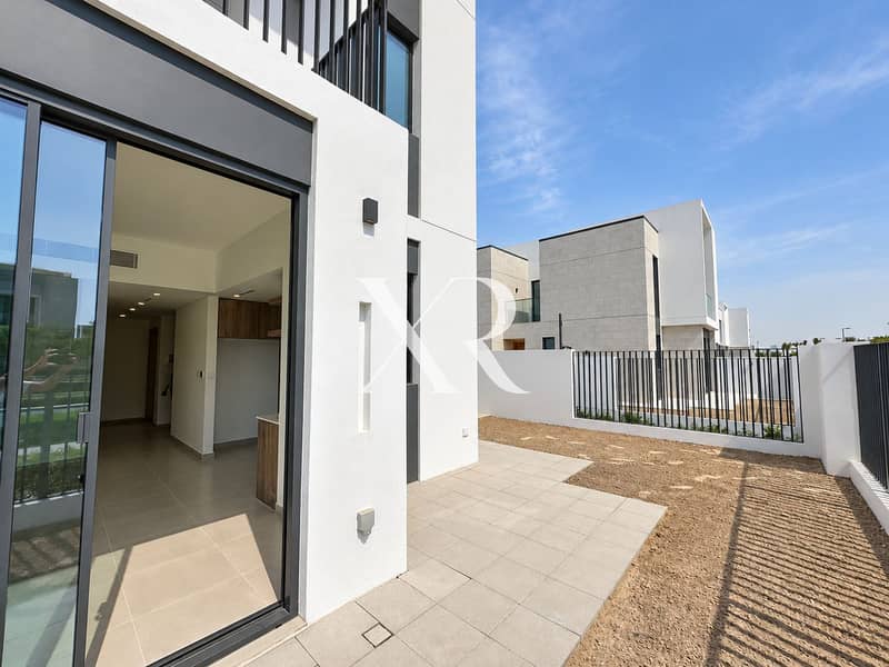 15 Sunlit White Facade and Patio. png