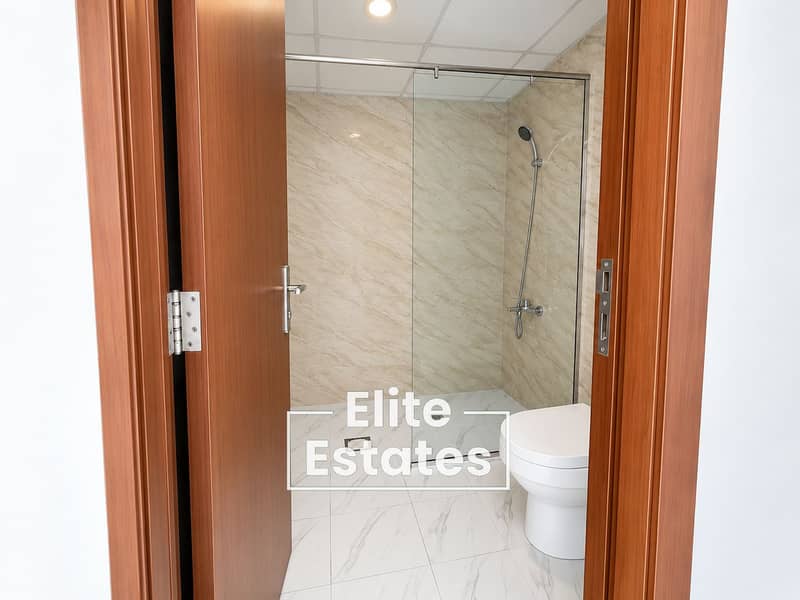 5 Modern Marble Bathroom Through Open Door. png