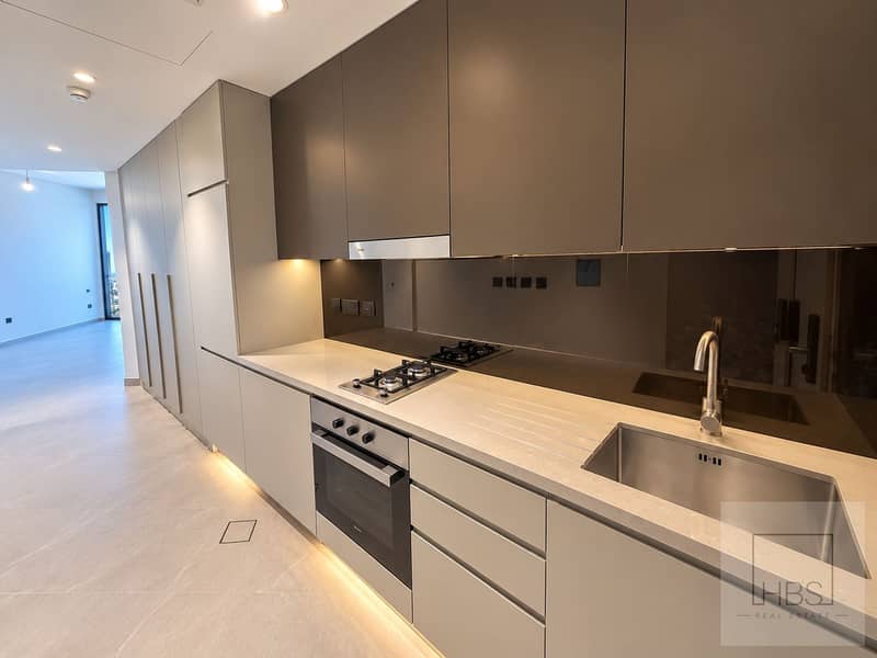 2 Modern Galley Kitchen with City View. png