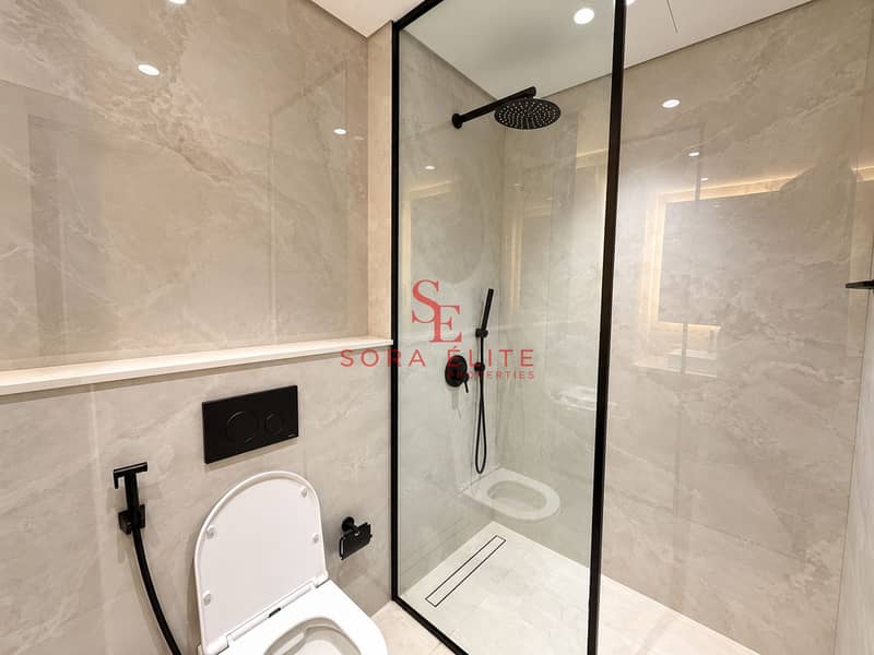 9 Modern Marble Bathroom with Matte-Black Fixtures. png