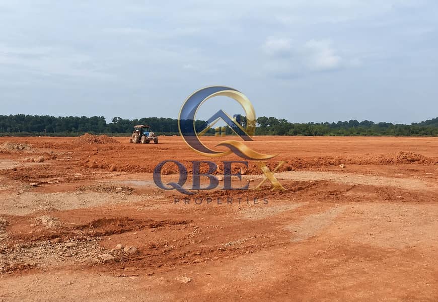 Red Clay Construction Site and Distant Trees. png Red Clay Construction Site and Distant Trees. png