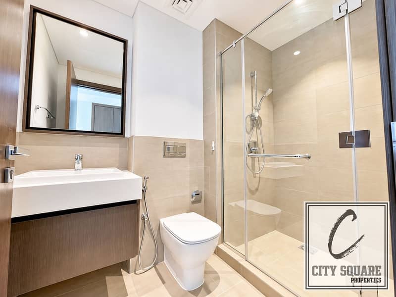 8 resize_Modern Beige Bathroom with Glass Shower. png