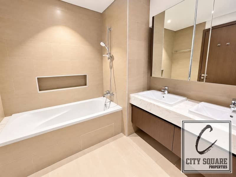 11 resize_Modern Beige Tile Bathroom with Double Vanity. png