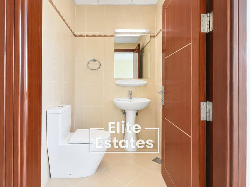 6 Modern Beige Tiled Powder Room. png