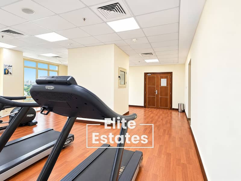 14 Modern Gym with Technogym Treadmill. png