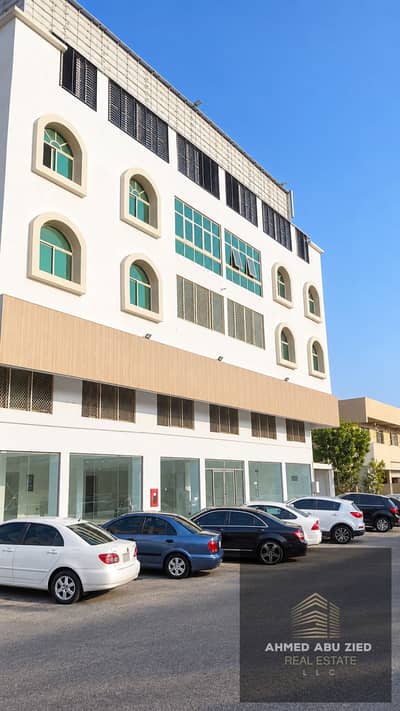 Building for Sale in Al Rawda, Ajman - مبنى تجاري حديث وسيارات متوقفة. png Building for Sale in Al Rawda, Ajman - مبنى تجاري حديث وسيارات متوقفة. png