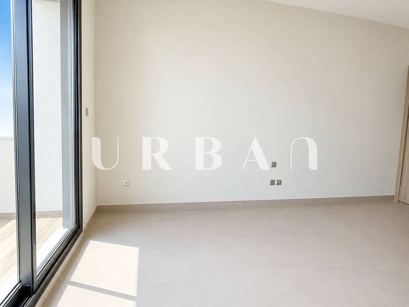 2 Bright Minimalist Room with Balcony Door. png