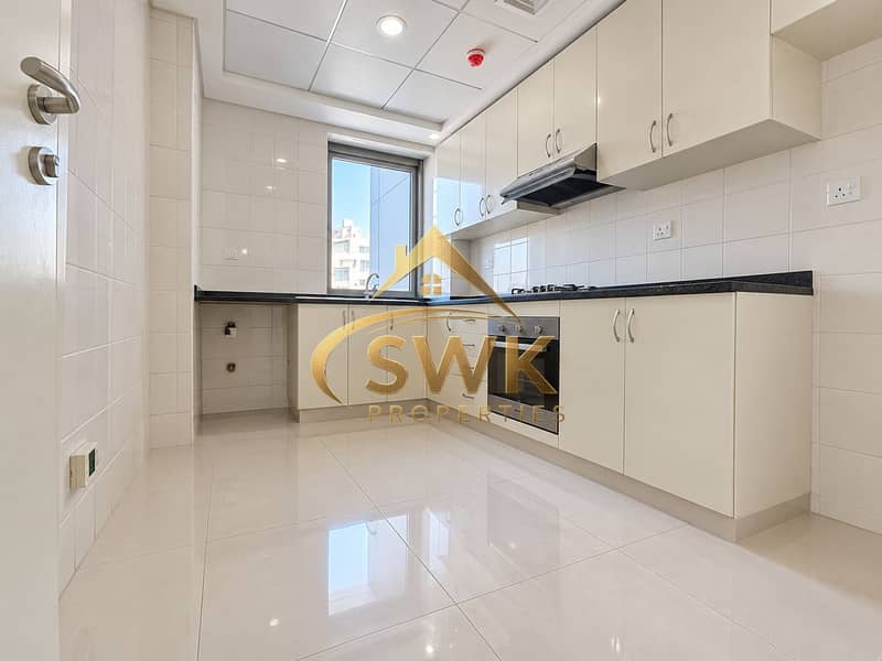 6 Bright Modern L-Shaped Kitchen. png