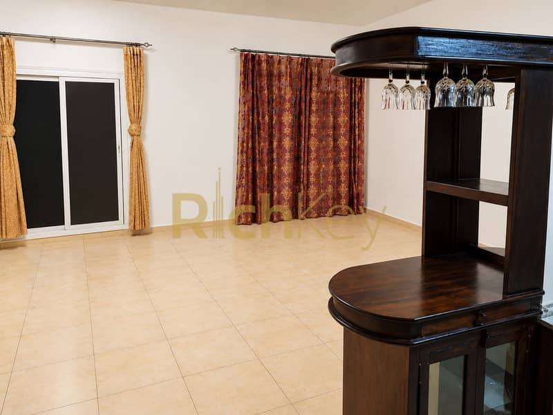 6 Staged Living Room with Home Bar. png