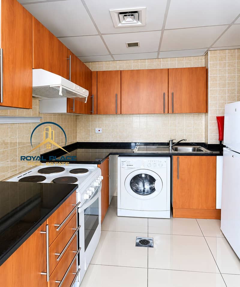 8 Bright Modern Kitchen with Washer and Fridge. png