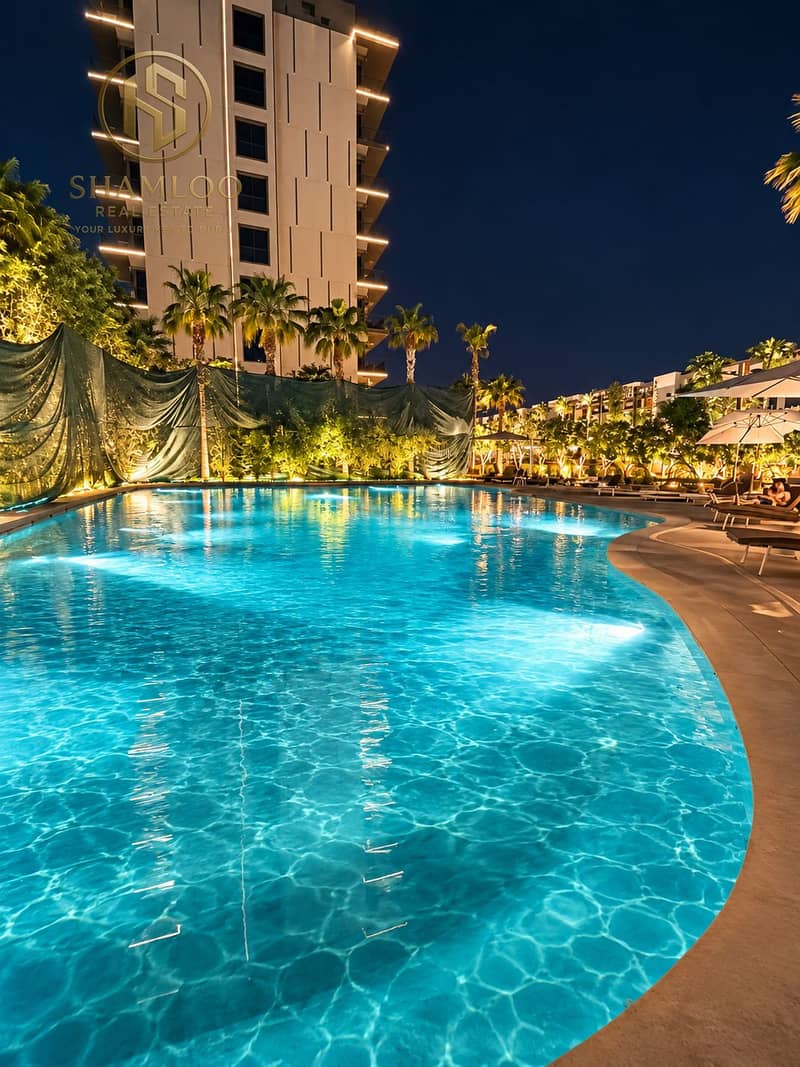10 Neon Oasis_ Luxury Resort Pool at Night. png