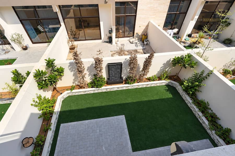 21 Sunlit Modern Townhouse Garden Courtyard. png