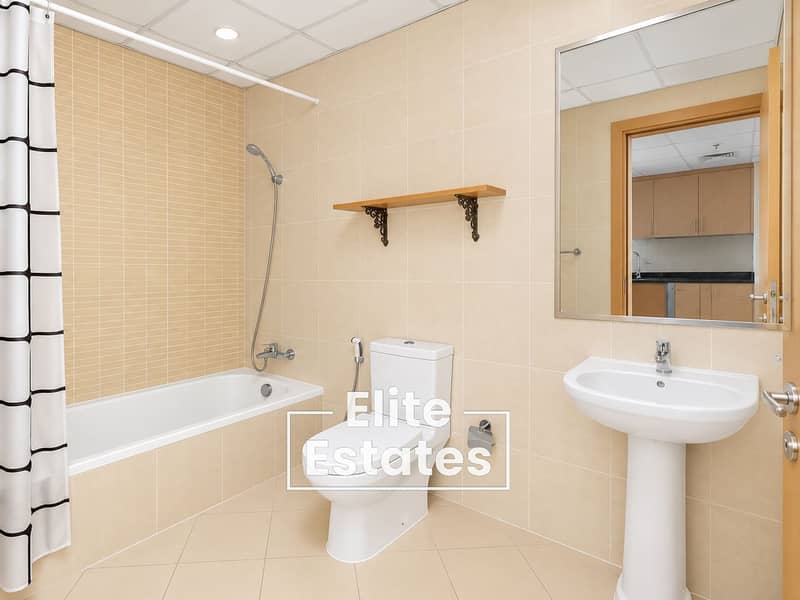 10 Bright Minimalist Beige Tiled Bathroom (1). png